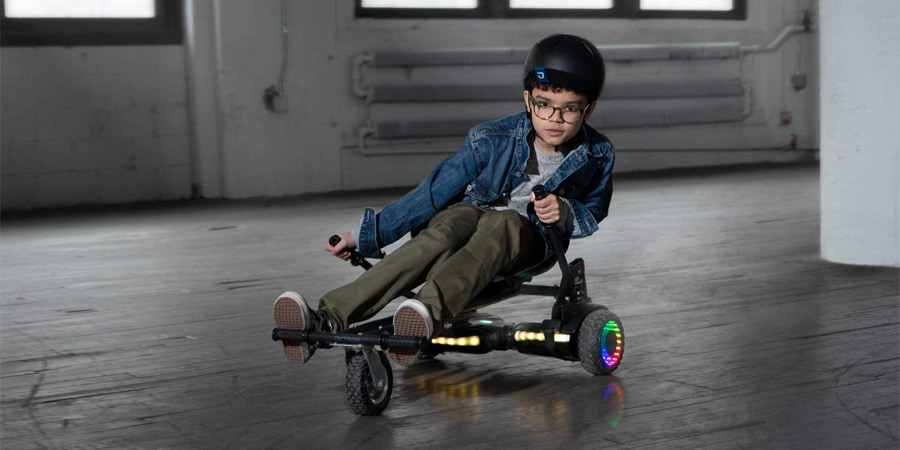 Kid riding hoverboard cart